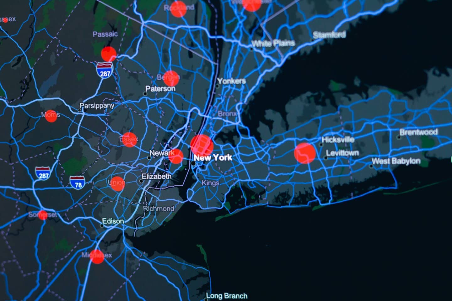 Digital map with blue routes and red data points.
